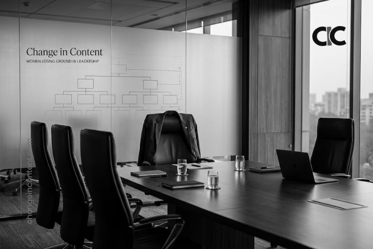 An empty executive chair with a women’s blazer in a corporate boardroom, representing women losing ground in leadership.
