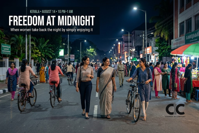 Women walk, cycle and visit a night market on a brightly lit Thiruvananthapuram street, representing Kerala’s Freedom at Midnight initiative on Independence Day eve.