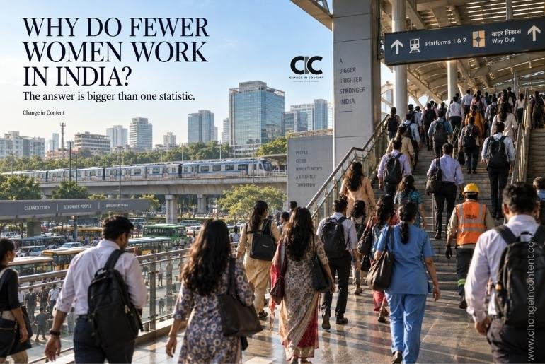 Women and men commuting through a busy modern Indian transport hub during the morning work rush, accompanying an analysis of India's gender gap in labour-force participation.