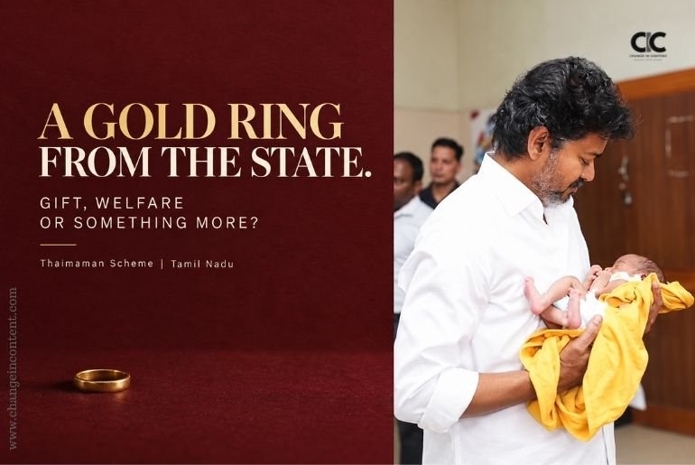 Tamil Nadu Chief Minister Vijay holding a newborn alongside a small gold ring, accompanying an analysis of the Thaimaman scheme and its gendered welfare framing.
