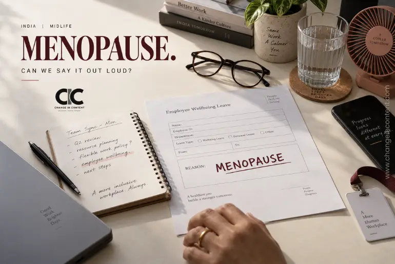 Workplace desk with an empty “reason” field on a form and the word “Menopause”, representing how women's midlife health often remains undisclosed at work.