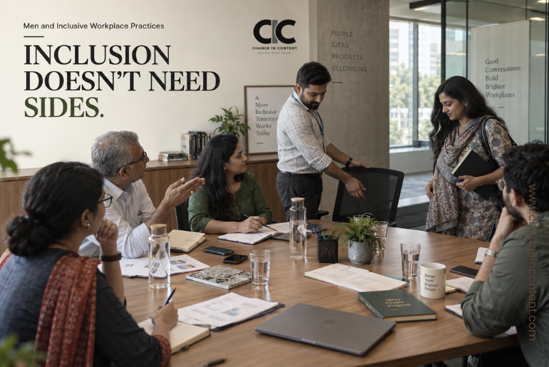 A male colleague naturally moves his chair to make room for another participant during an Indian workplace meeting, representing inclusion as everyday behaviour rather than a symbolic gesture.