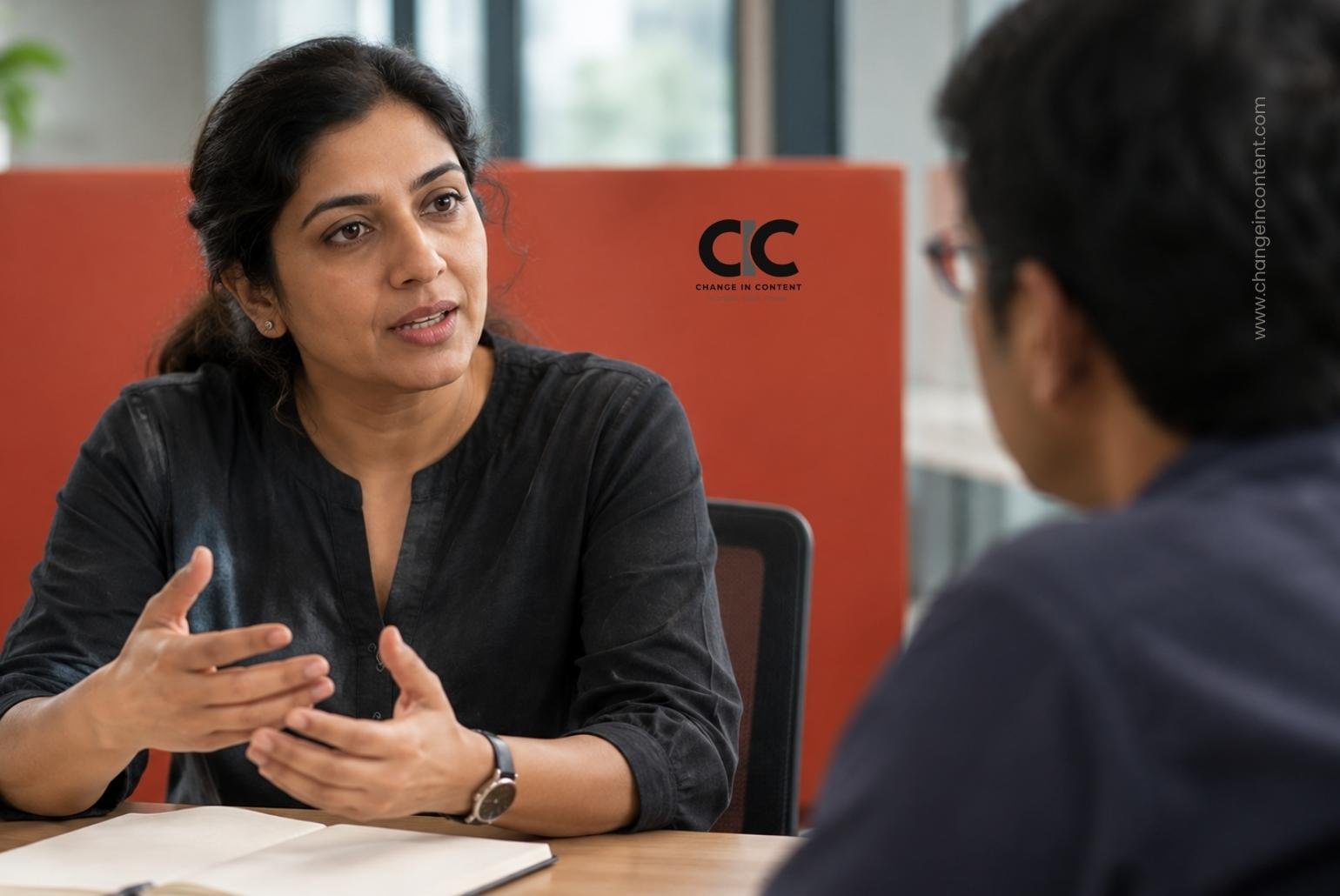 Conceptual illustration of an Indian professional discussing a work arrangement with a colleague.