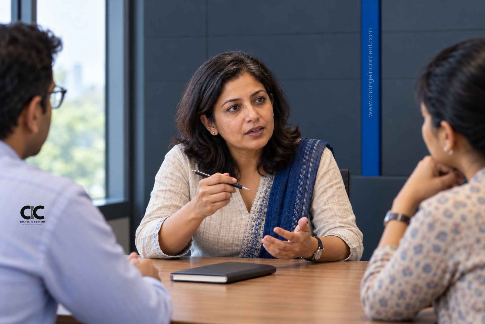 Conceptual illustration of an Indian woman questioning a decision during a leadership meeting.